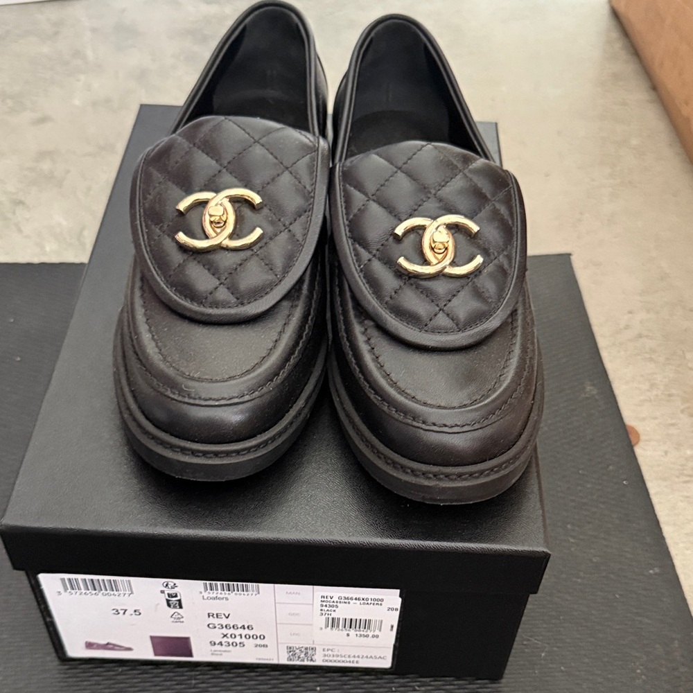 CHANEL Black Quilted Slip-On Loafers with Gold Accents